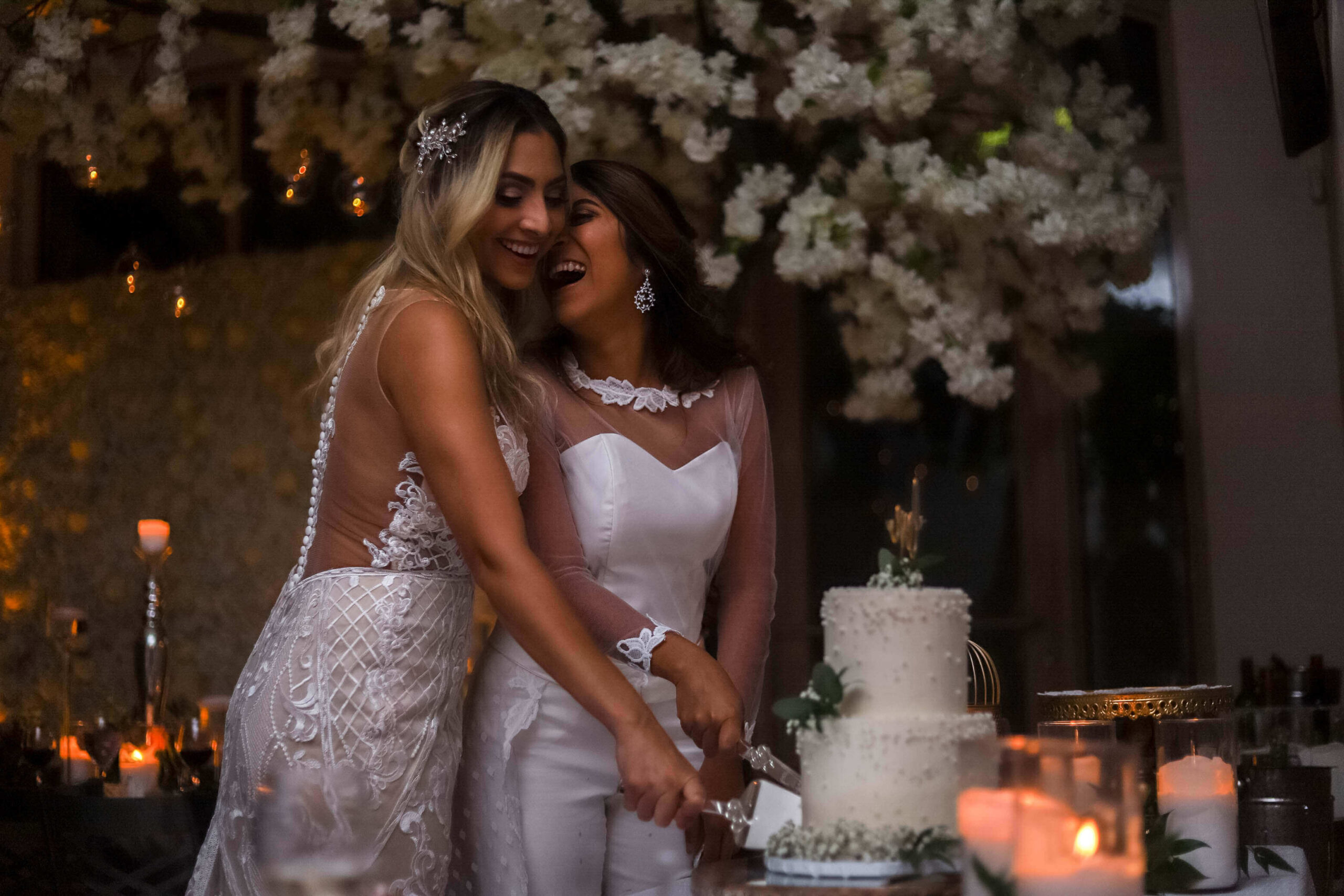 brides cutting cake at LGBT wedding in Miami Florida
