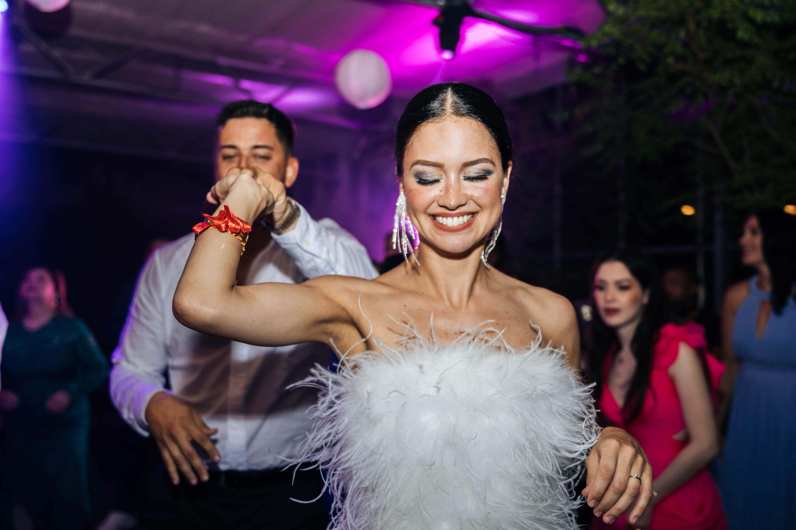 bride groom and wedding planner at a party